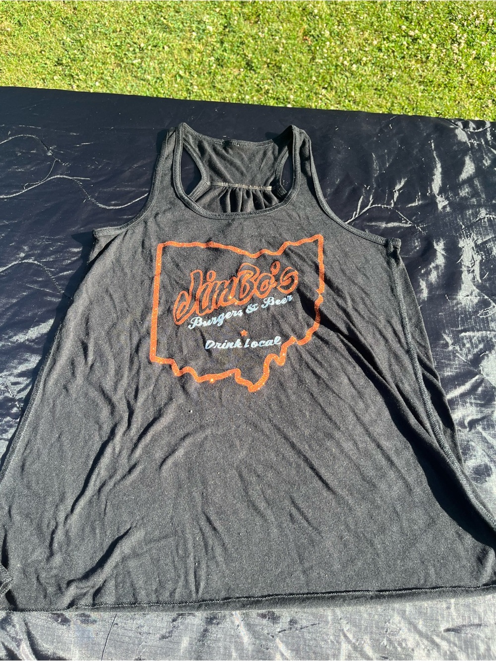Jimbos Drink Local Black Racerback Tank Top with glittery Orange Logo